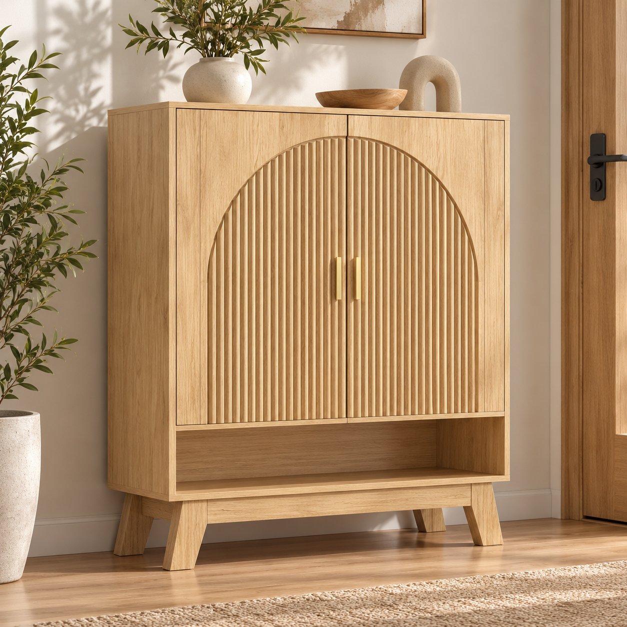 Fluted oak shoe cabinet with arched doors in a bright entryway
